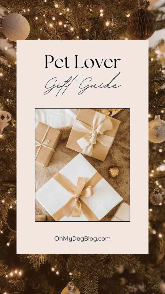 In the background, a Christmas tree is decorated with sparkling lights and silver and gold balls. In the center is a set of presents wrapped in white and gold. The text overlay reads: Pet Lover Gift Guide